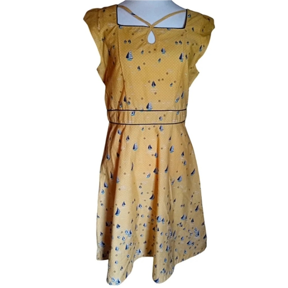 Yellow dress with blue sailboats